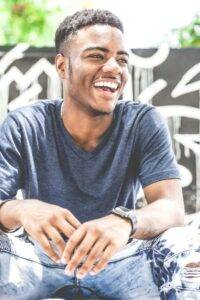 Happy man enjoying the benefits of therapy focused on mental wellness and stress relief for men.